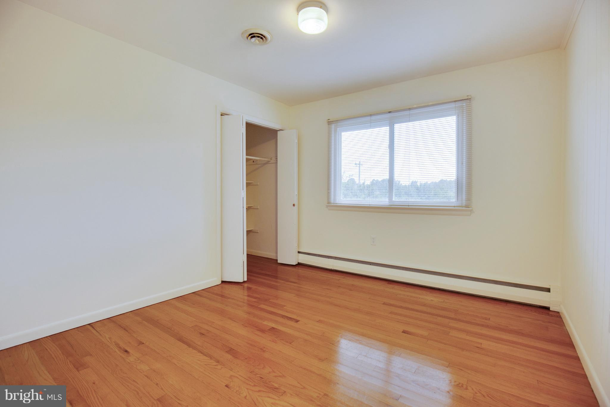620 Dalrymple Road Sunderland, MD 20689 - Photo 16 of 28 Upper level bedroom with hardwood floors
