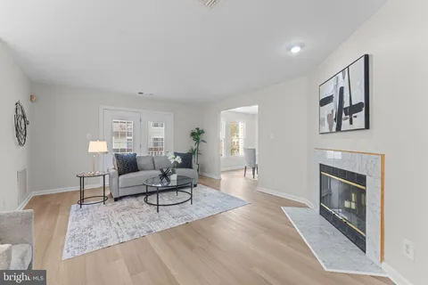 a kitchen with granite countertop wooden cabinets and white appliances