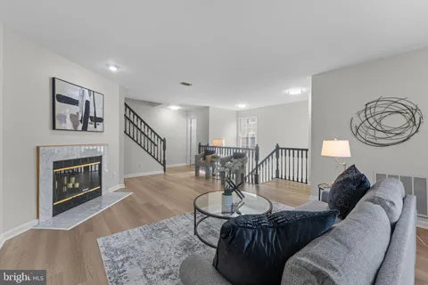 a bathroom with a granite countertop toilet a sink and mirror