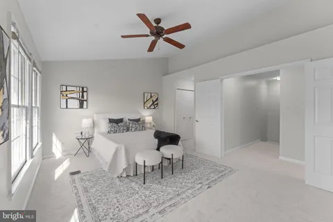 an aerial view of a house with a swimming pool