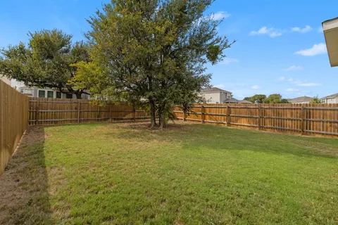 a view of outdoor space with garden and trees