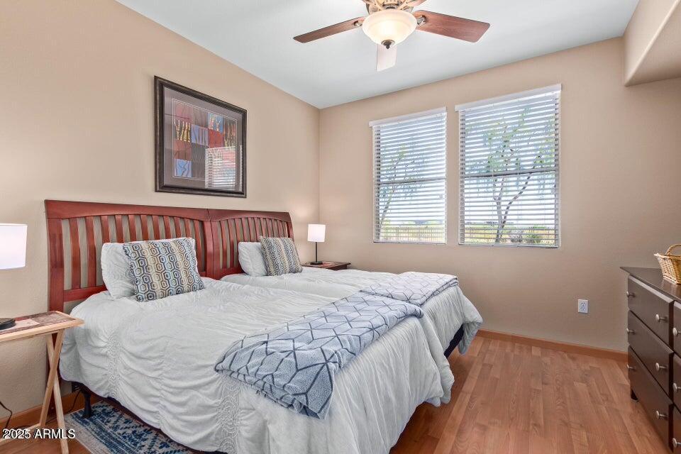 19777 North 76th Street, Unit 1332 Scottsdale, AZ 85255 - Photo 11 of 25 a bedroom with a bed and a window