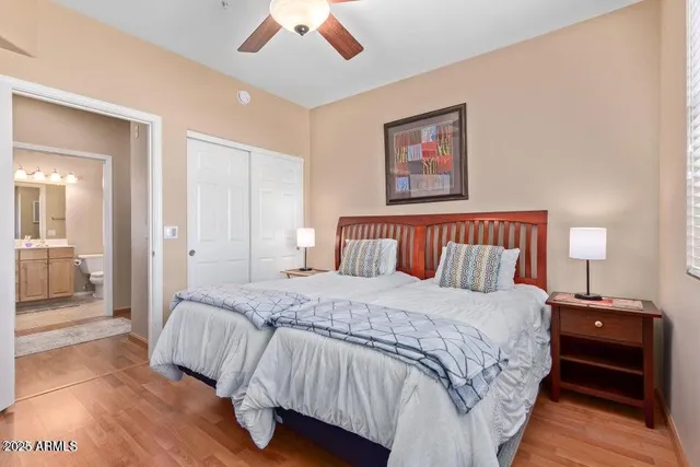 a bedroom with a bed and a lamp