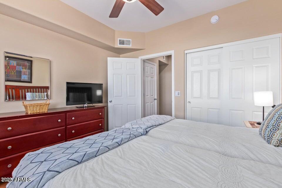 19777 North 76th Street, Unit 1332 Scottsdale, AZ 85255 - Photo 13 of 25 a bedroom with a bed and a television