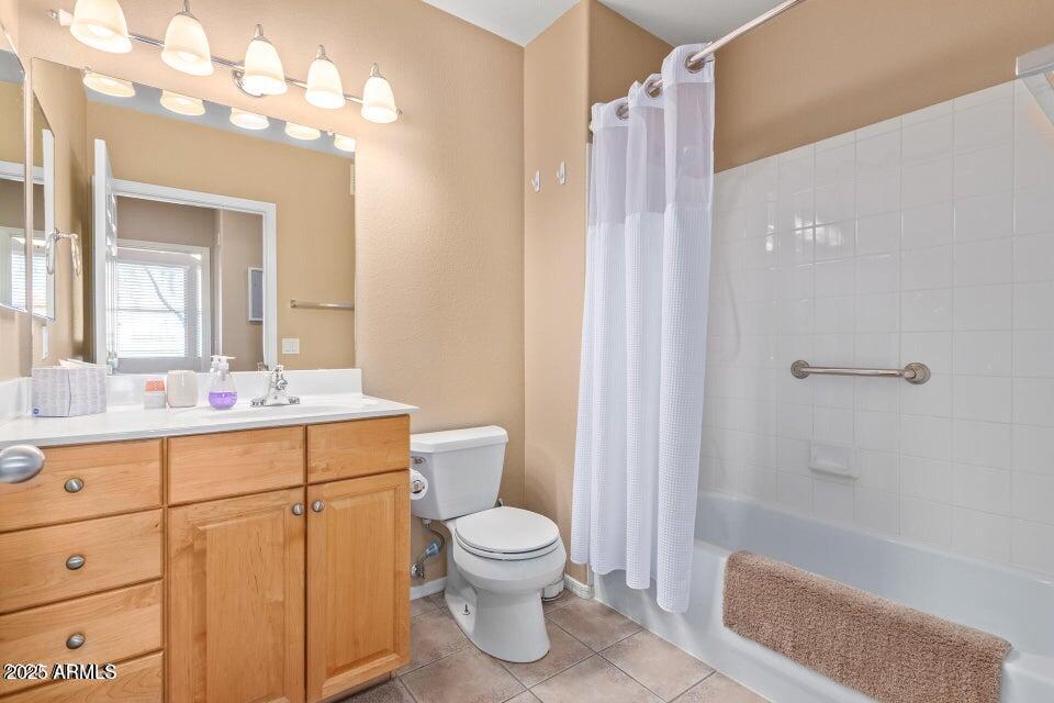 19777 North 76th Street, Unit 1332 Scottsdale, AZ 85255 - Photo 14 of 25 a bathroom with a sink a toilet and shower