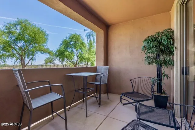 a view of swimming pool with seating space