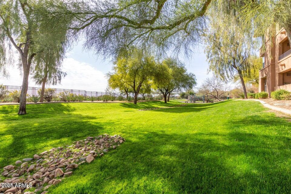 19777 North 76th Street, Unit 1332 Scottsdale, AZ 85255 - Photo 24 of 25 a view of swimming pool with yard