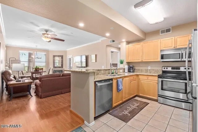 a kitchen with a sink cabinets and appliances
