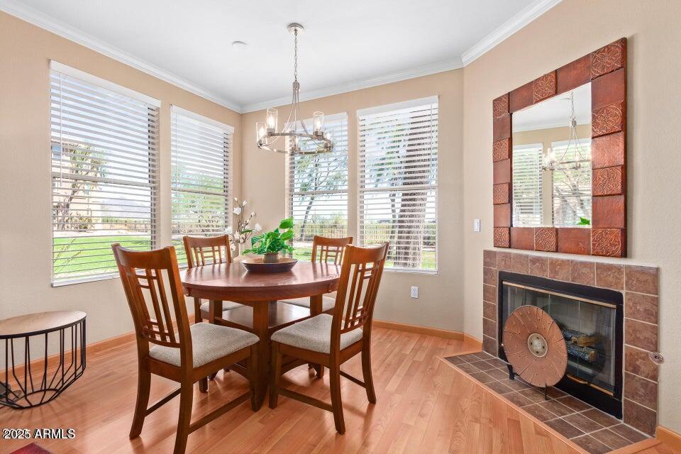 19777 North 76th Street, Unit 1332 Scottsdale, AZ 85255 - Photo 5 of 25 a view of a dining room with furniture window and wooden floor