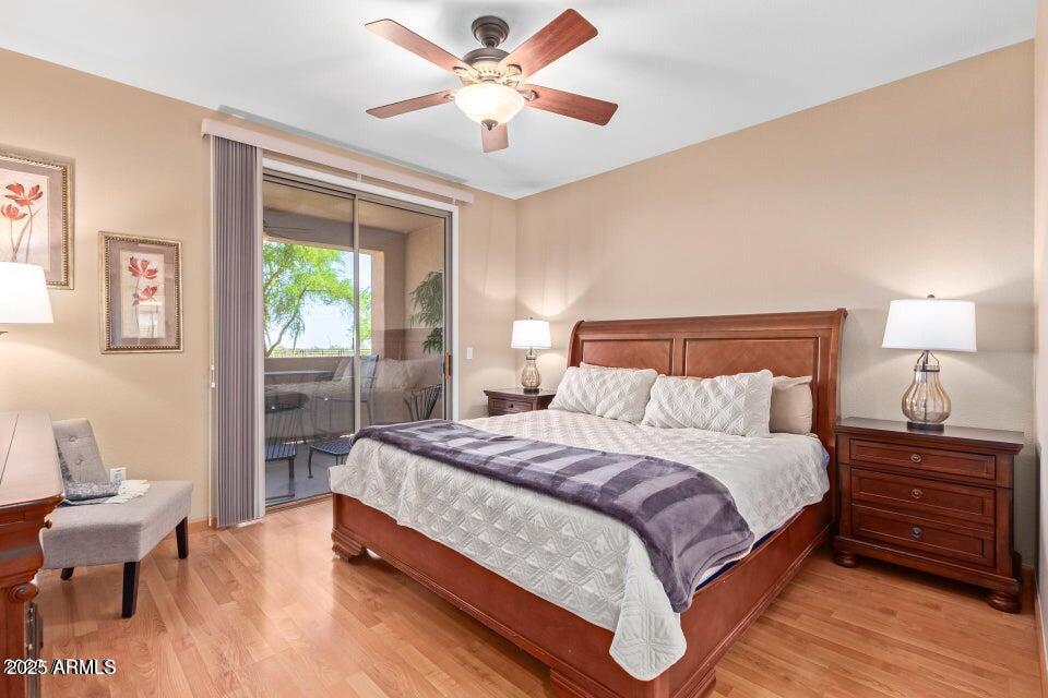 19777 North 76th Street, Unit 1332 Scottsdale, AZ 85255 - Photo 6 of 25 a bedroom with a bed and a chandelier