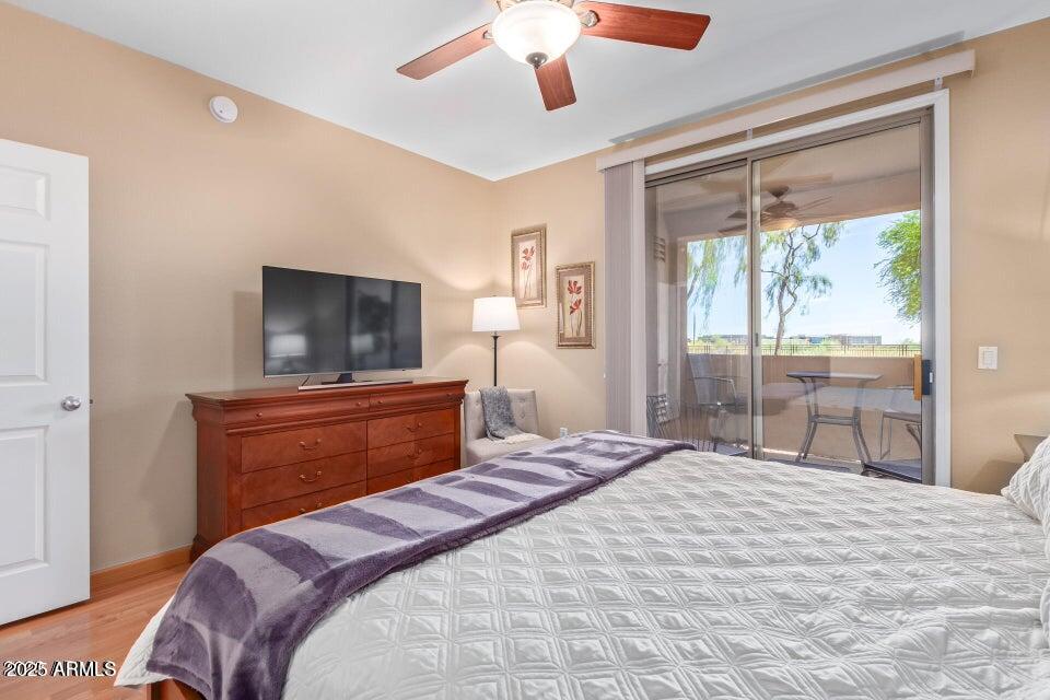 19777 North 76th Street, Unit 1332 Scottsdale, AZ 85255 - Photo 7 of 25 a bedroom with a bed and a flat screen tv