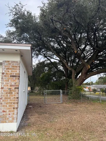 a backyard of a house with lots of green space