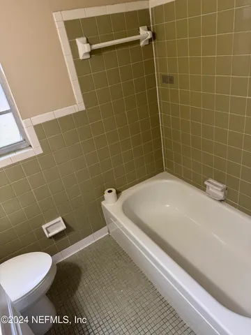 a bathroom with a sink and toilet