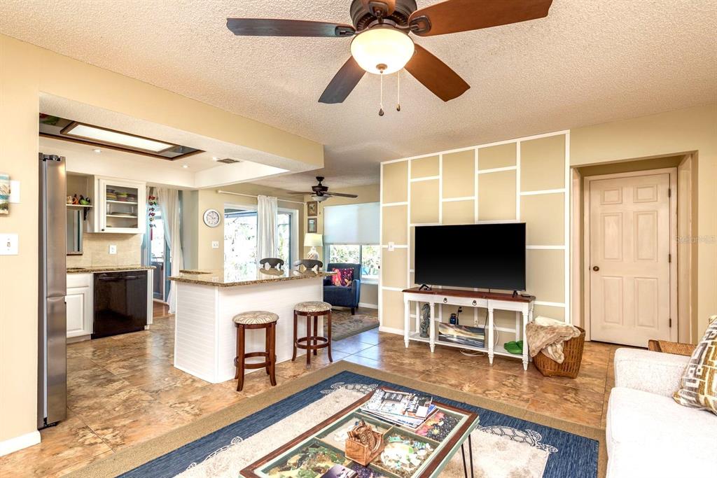 2011 Del-Betmar Road Clearwater, FL 33763 - Photo 14 of 51 a living room with fireplace furniture and a flat screen tv