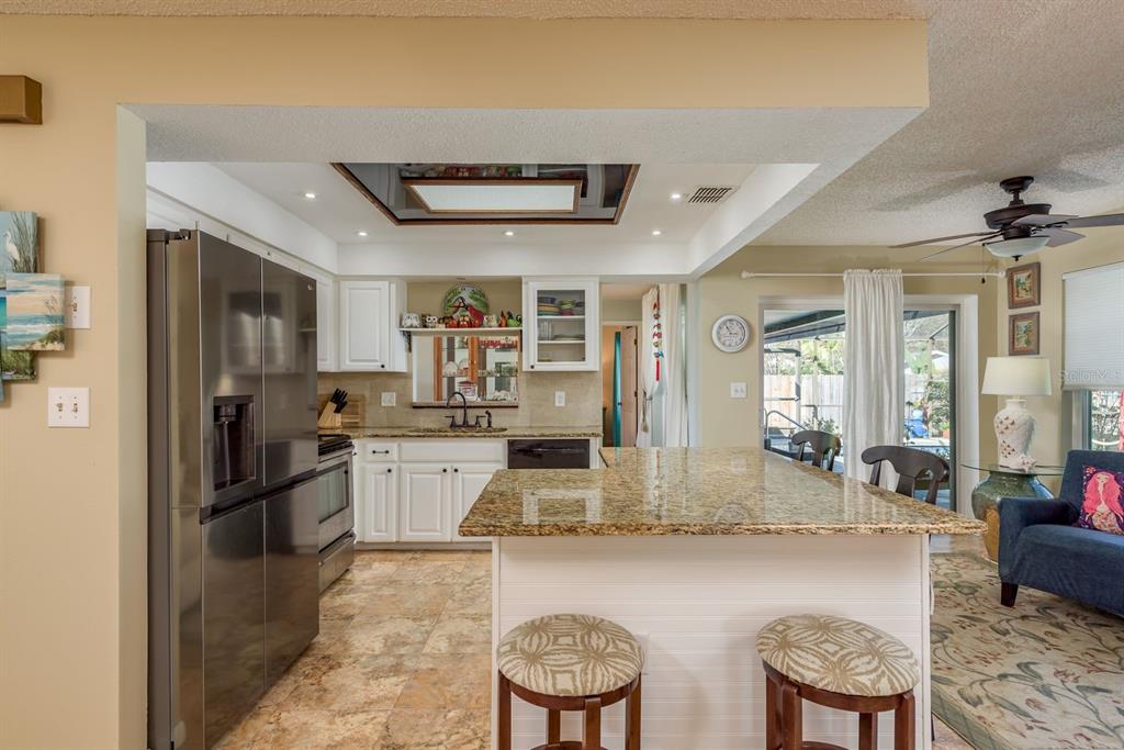 2011 Del-Betmar Road Clearwater, FL 33763 - Photo 17 of 51 a kitchen with refrigerator and cabinets