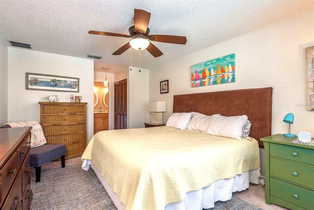 2011 Del-Betmar Road Clearwater, FL 33763 - Photo 23 of 51 a bedroom with a bed and a chandelier