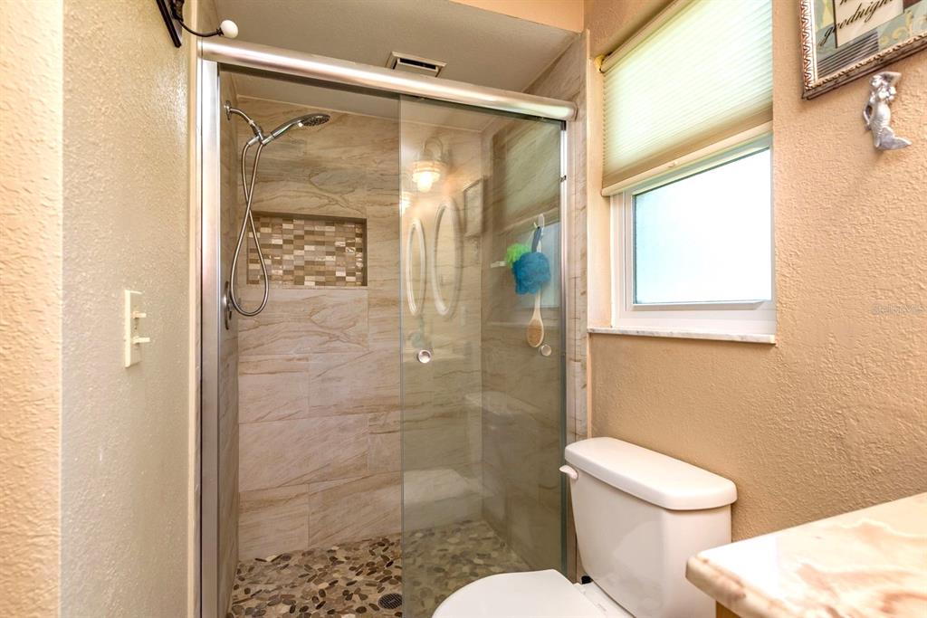 2011 Del-Betmar Road Clearwater, FL 33763 - Photo 26 of 51 a bathroom with a shower and a toilet
