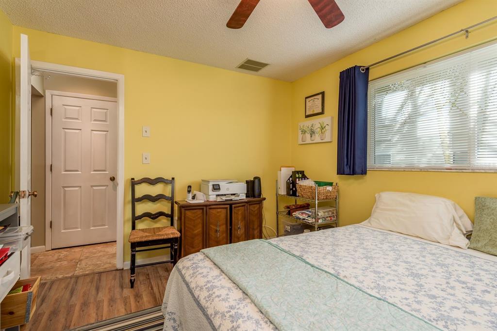 2011 Del-Betmar Road Clearwater, FL 33763 - Photo 28 of 51 a bedroom with a bed and wooden floor