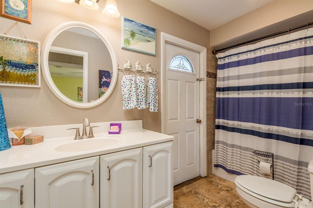 2011 Del-Betmar Road Clearwater, FL 33763 - Photo 29 of 51 a bathroom with a sink a vanity and a mirror