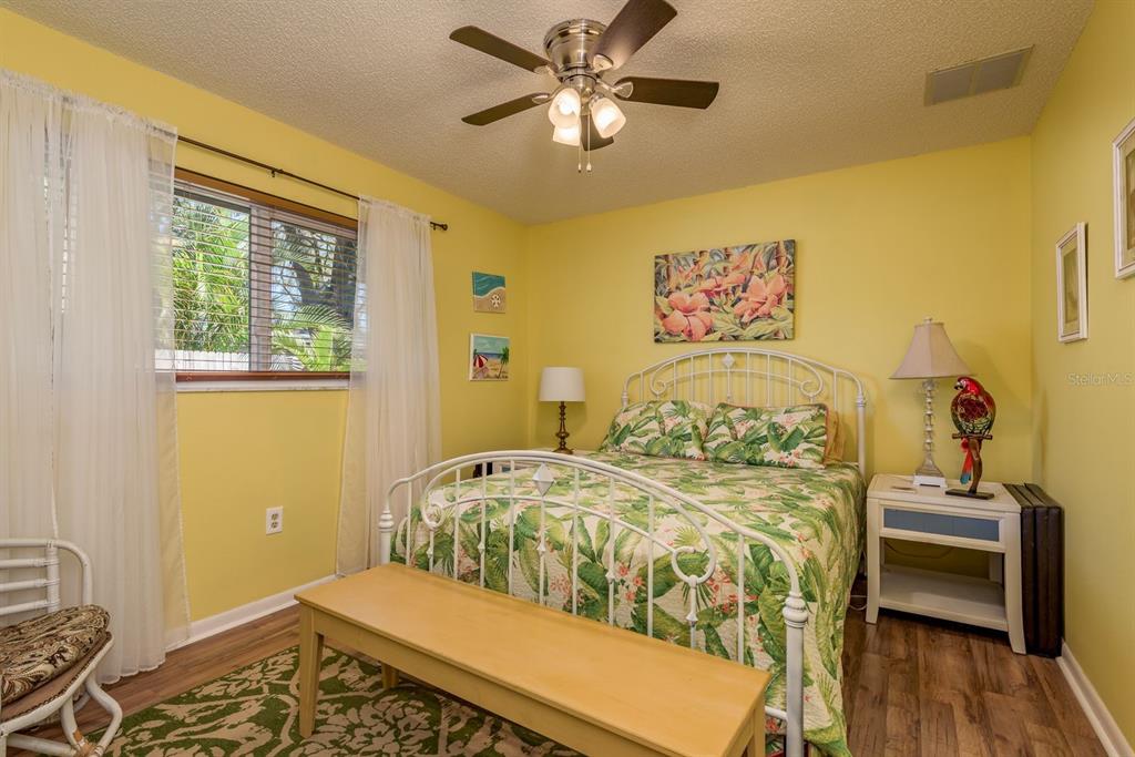 2011 Del-Betmar Road Clearwater, FL 33763 - Photo 31 of 51 a bedroom with a bed and wooden floor