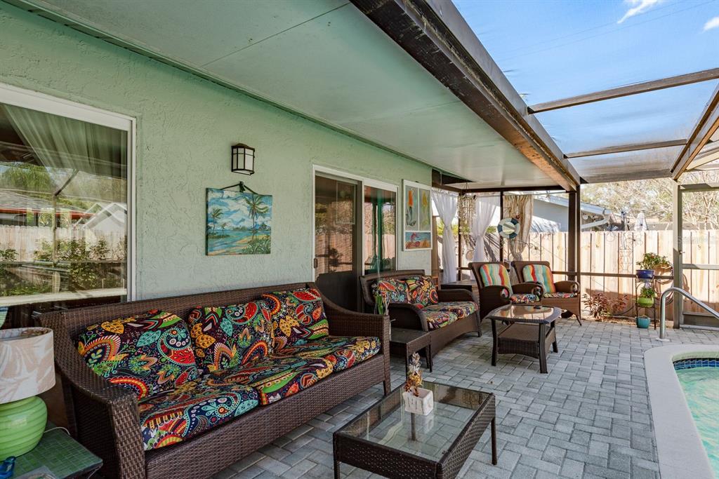 2011 Del-Betmar Road Clearwater, FL 33763 - Photo 35 of 51 a living room with furniture and a floor to ceiling window