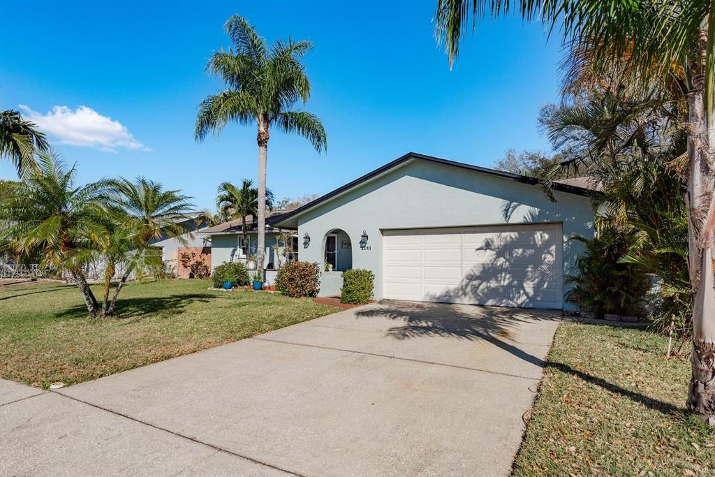 2011 Del-Betmar Road Clearwater, FL 33763 - Photo 42 of 51 a front view of a house with a yard and garage