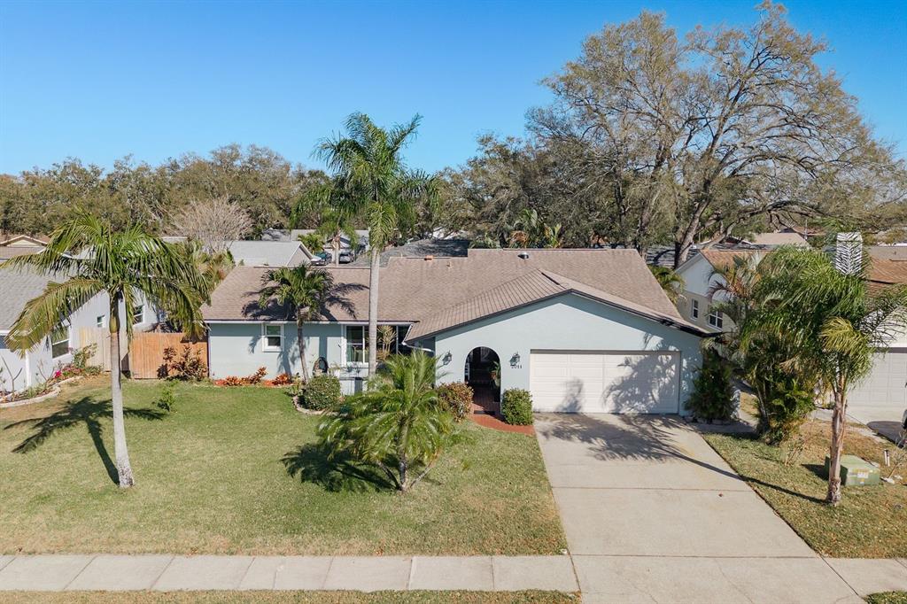 2011 Del-Betmar Road Clearwater, FL 33763 - Photo 43 of 51 a view of a white house next to a yard with plants and trees