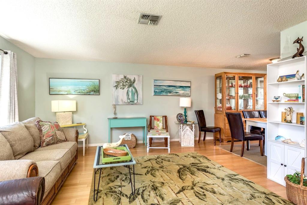 2011 Del-Betmar Road Clearwater, FL 33763 - Photo 7 of 51 a living room with furniture wooden floor and a table
