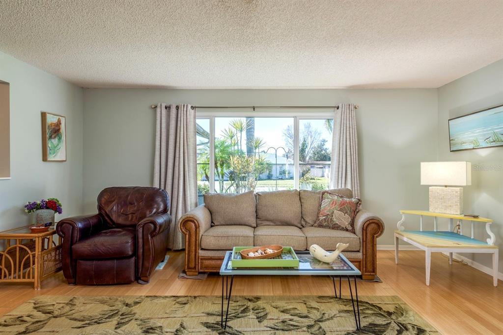 2011 Del-Betmar Road Clearwater, FL 33763 - Photo 9 of 51 a living room with furniture a rug and a large window