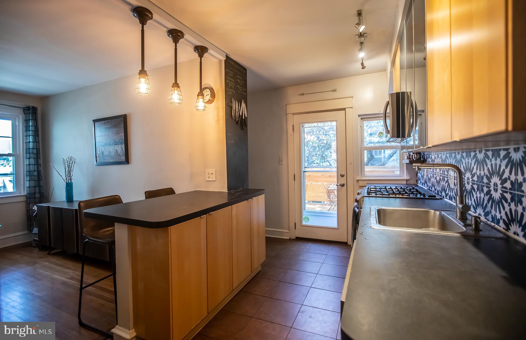 336 Wellesley Road Philadelphia, PA 19119 - Photo 11 of 27 Kitchen with rear door leading to deck