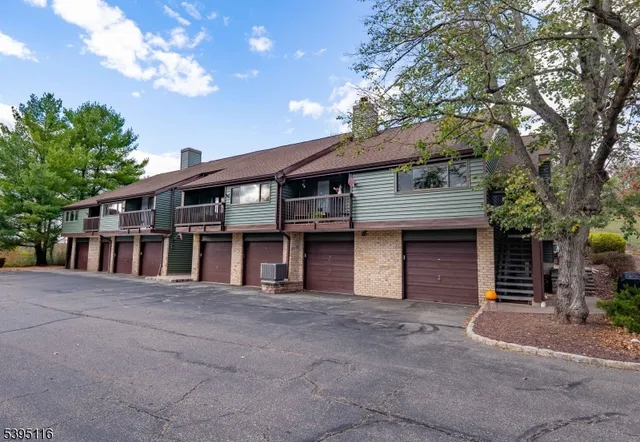 a view of a house with a door and deck