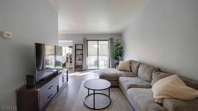 a kitchen with a sink a refrigerator and cabinets