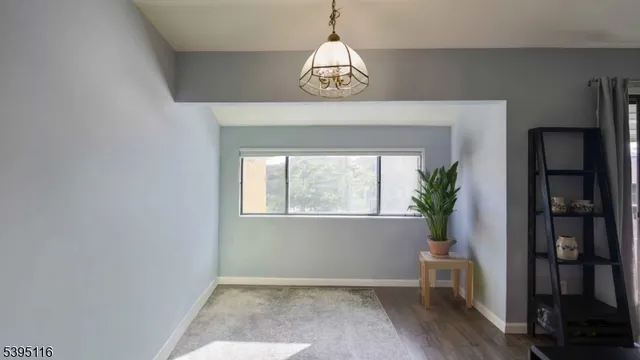 a bedroom with a bed dresser and a flat tv screen