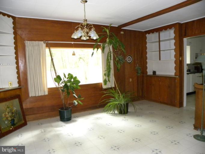 a view of a entryway door and dining room