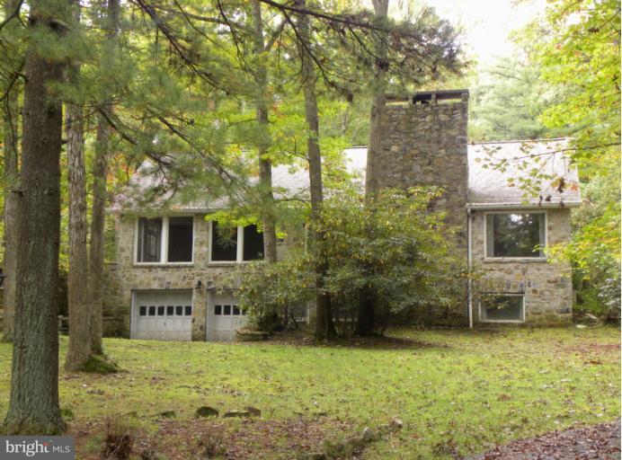 10246 Golf Course Road Fayetteville, PA 17222 - Photo 11 of 11 a brick building with a yard