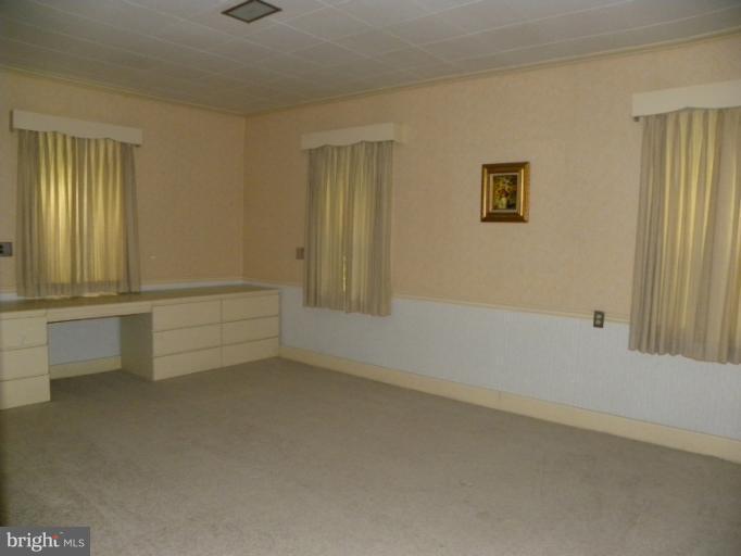 10246 Golf Course Road Fayetteville, PA 17222 - Photo 5 of 11 a view of an empty room with a window