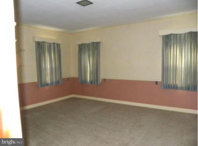 10246 Golf Course Road Fayetteville, PA 17222 - Photo 9 of 11 an empty room with windows