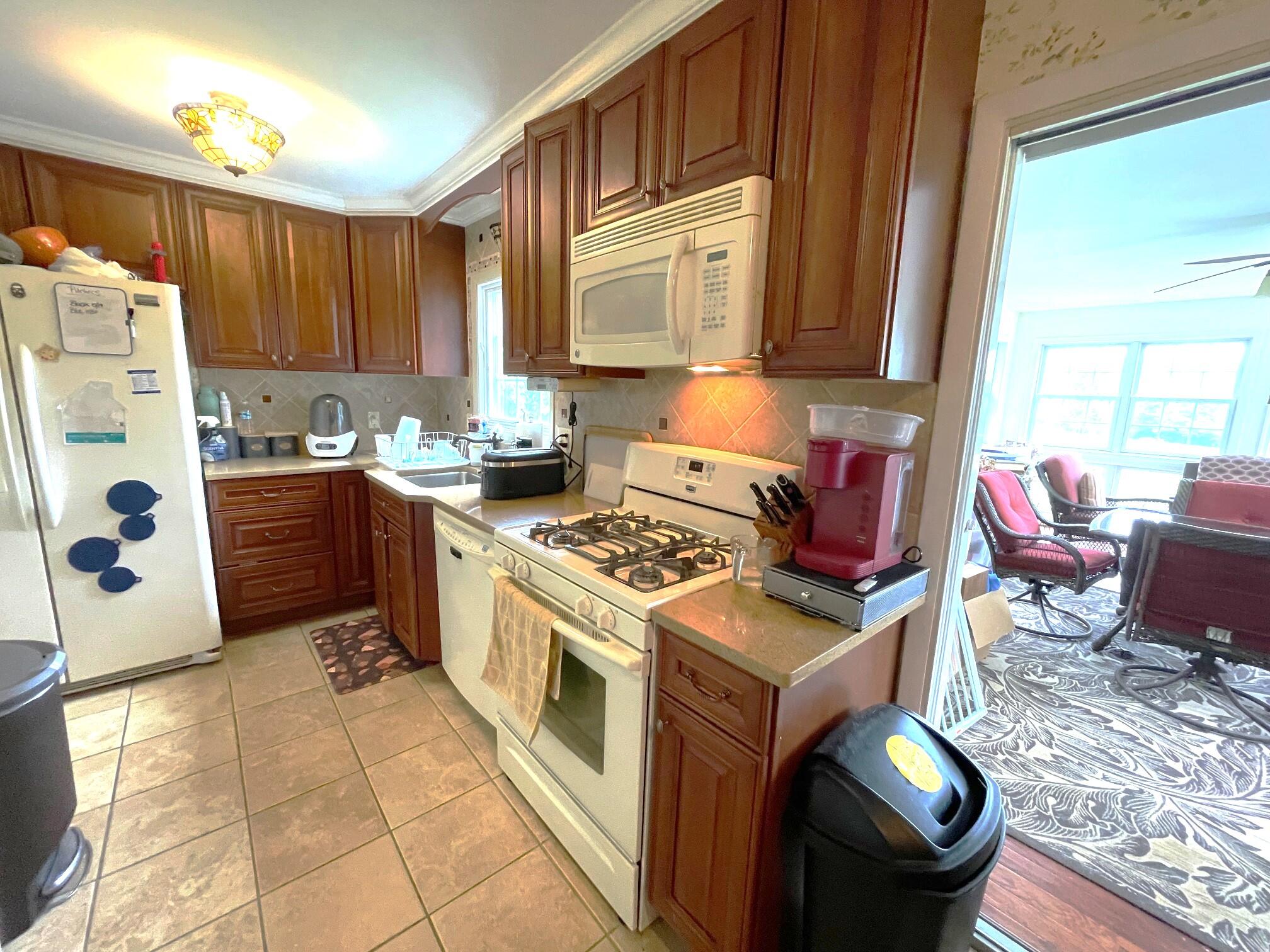 126 Friendship Road Kunkletown, PA 18058 - Photo 8 of 47 a kitchen with a stove window and cabinets