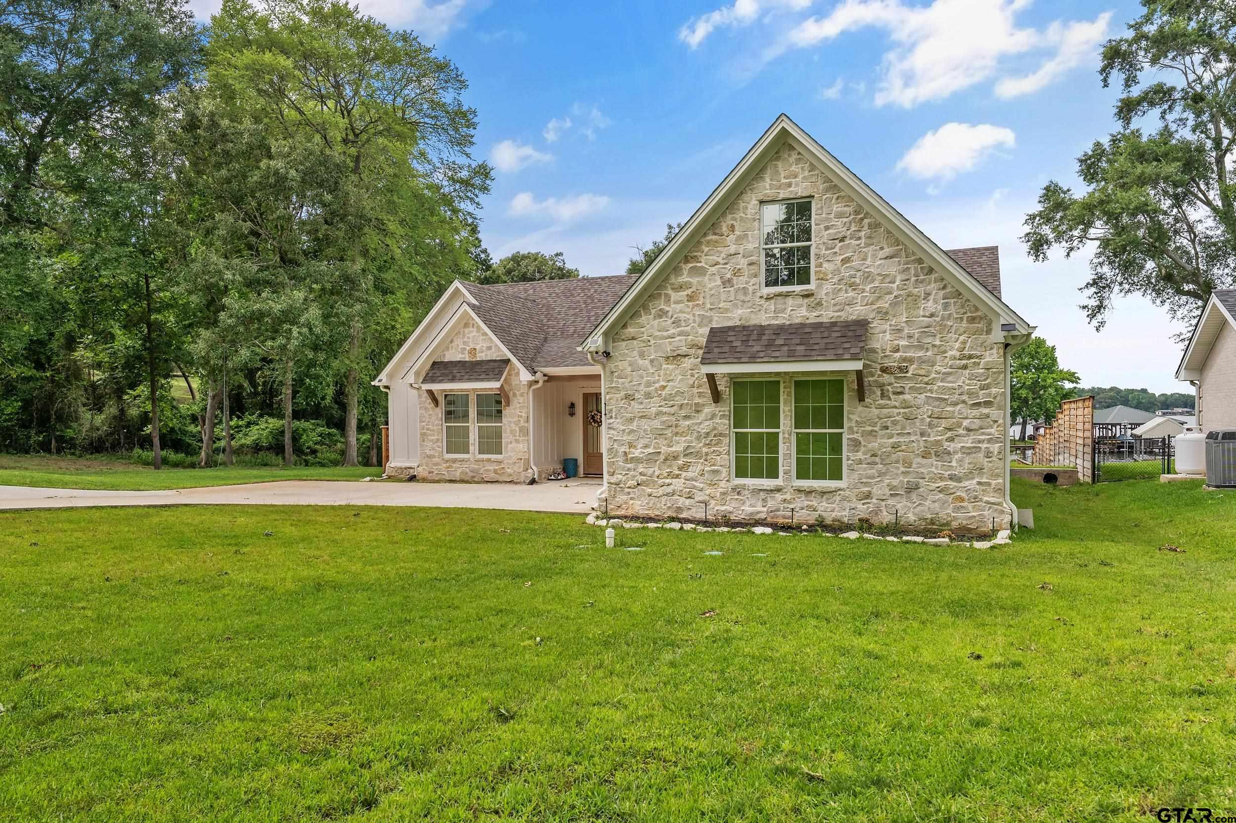 16837 Wilson Road Tyler, TX 75707 - Photo 5 of 44 a front view of a house with a yard