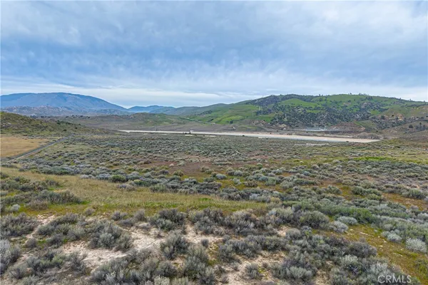 a view of a lake with mountain in the background