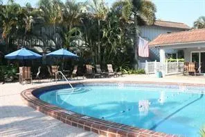 a swimming pool with outdoor seating yard and patio