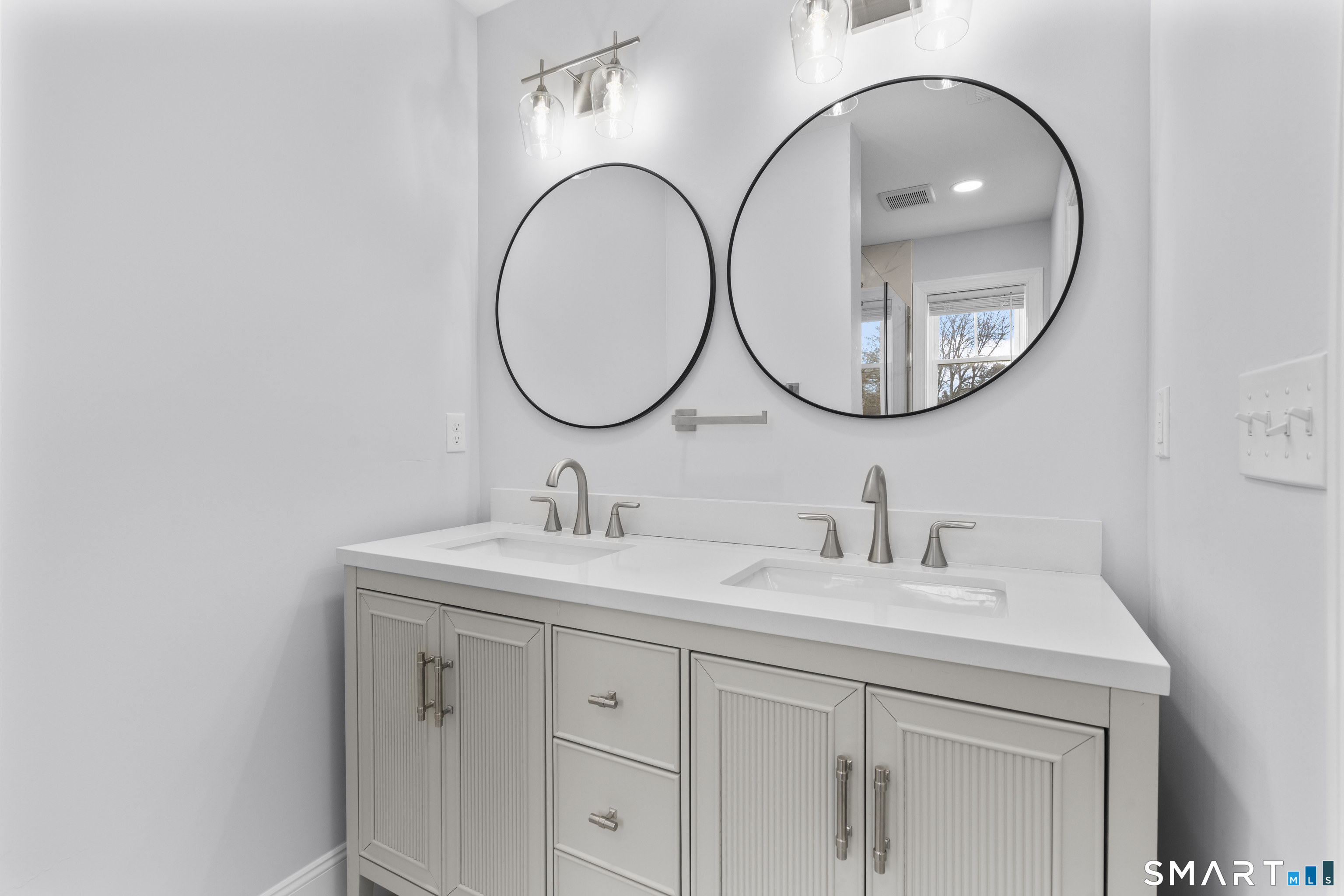 183 Vesper Street Fairfield, CT 06825 - Photo 15 of 40 a bathroom with a sink and a mirror