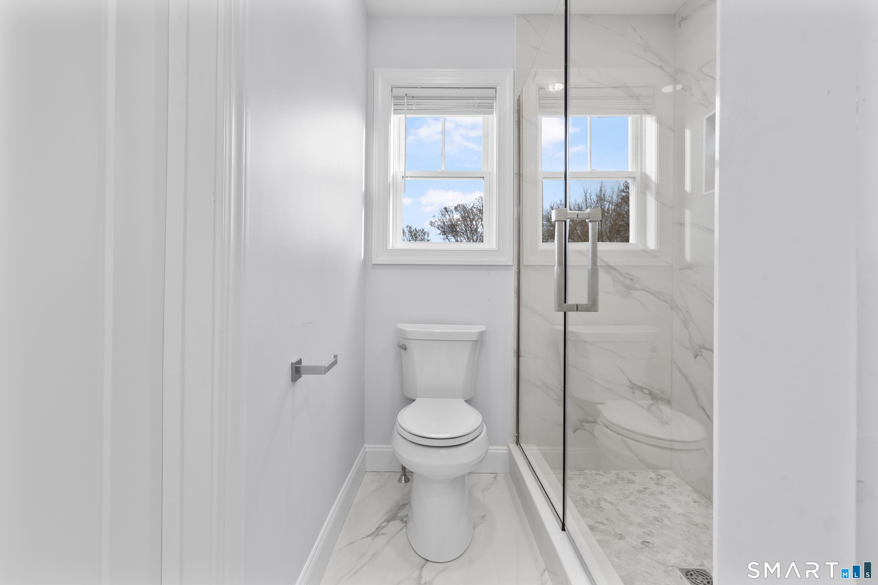 183 Vesper Street Fairfield, CT 06825 - Photo 16 of 40 a bathroom with a toilet and a shower