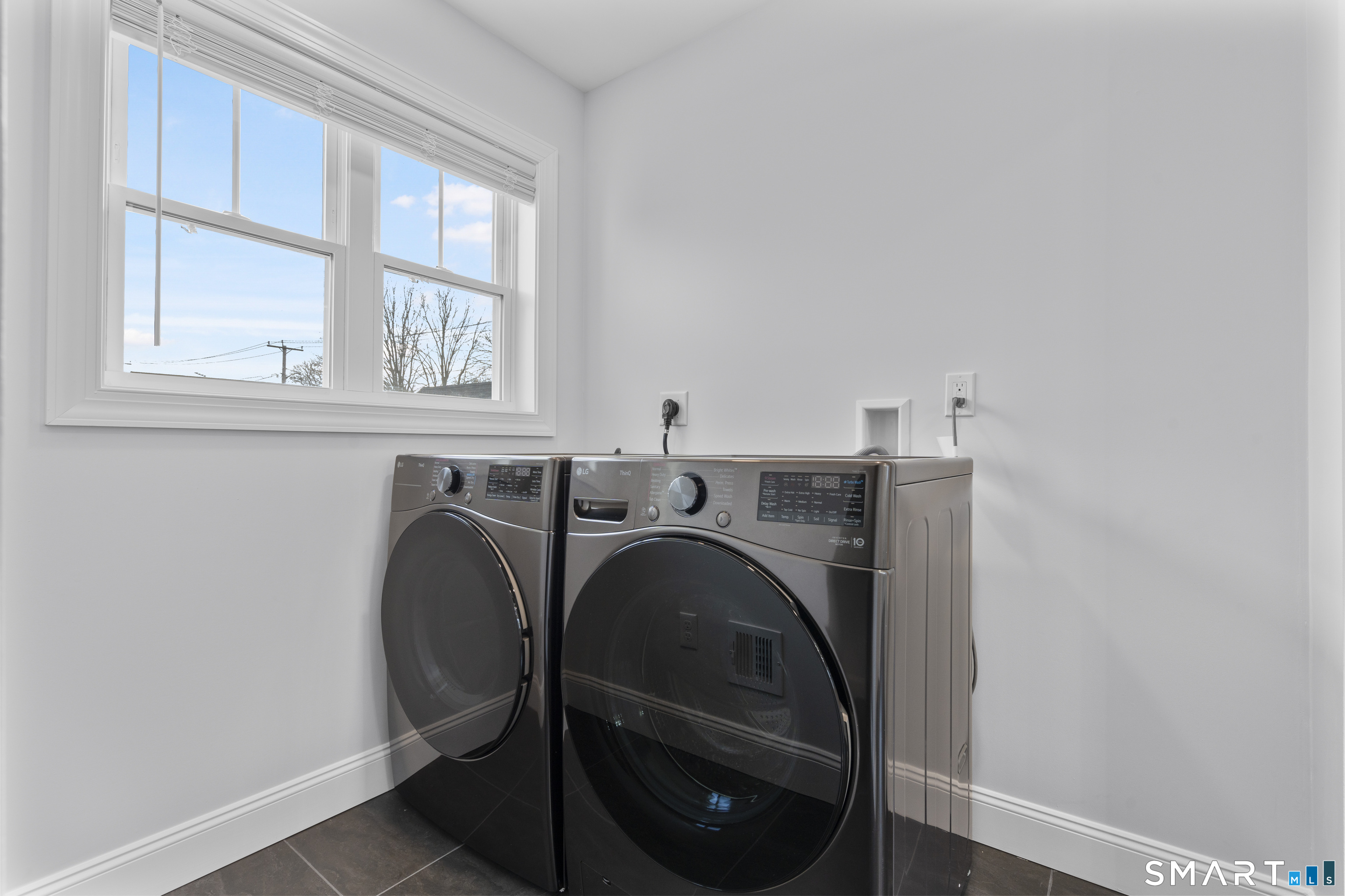 183 Vesper Street Fairfield, CT 06825 - Photo 23 of 40 a utility room with dryer and washer