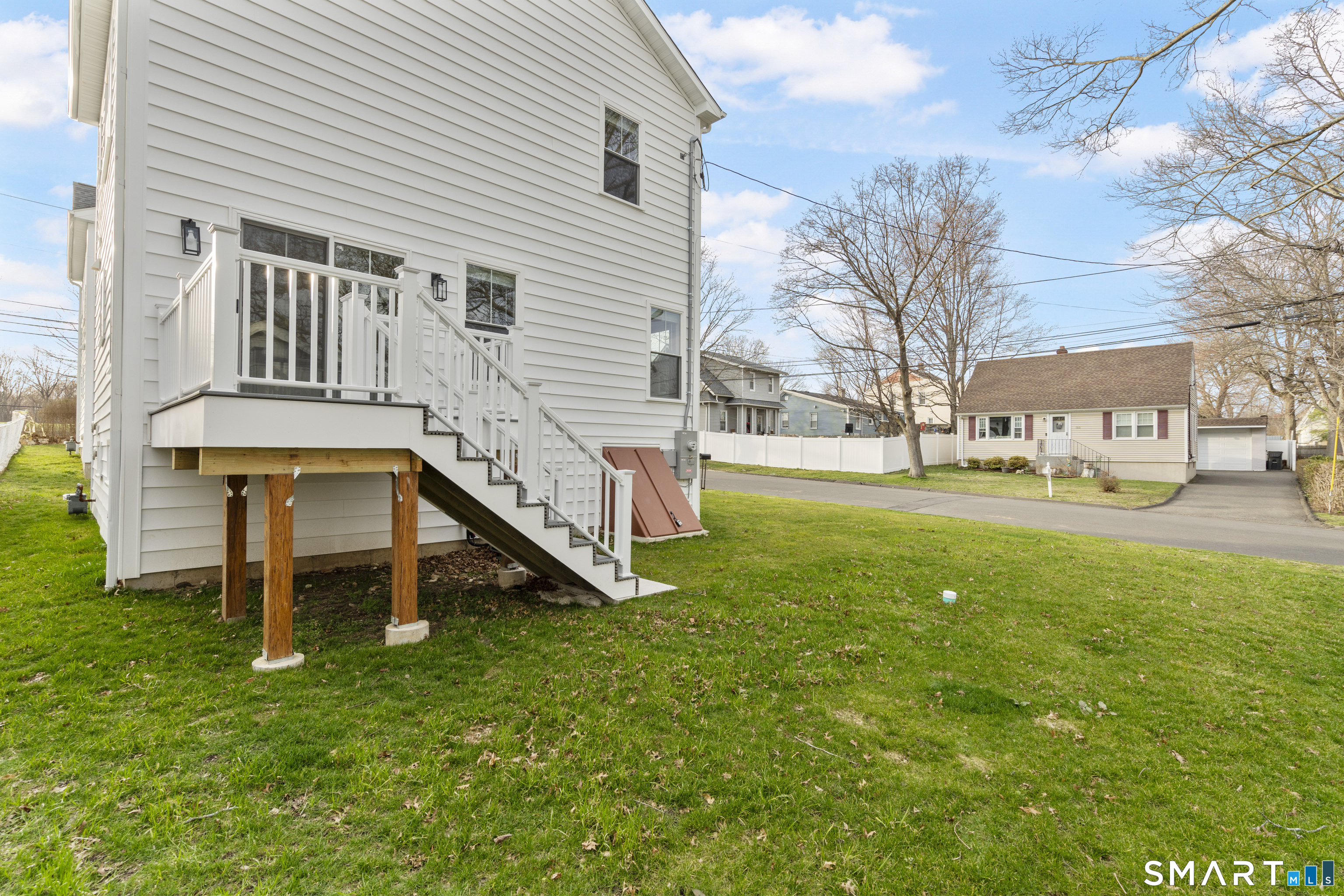 183 Vesper Street Fairfield, CT 06825 - Photo 37 of 40 a house view with a garden space