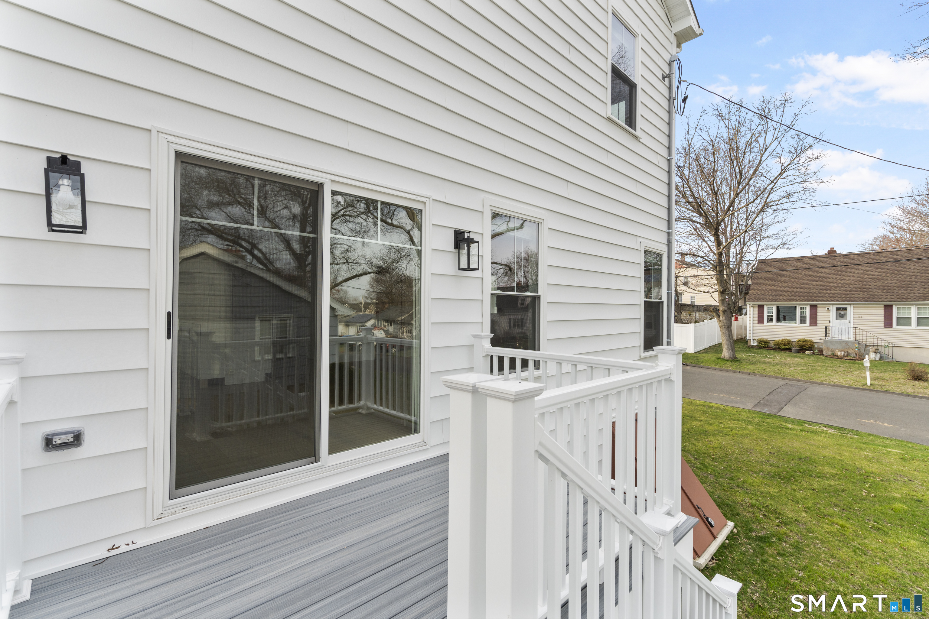 183 Vesper Street Fairfield, CT 06825 - Photo 38 of 40 a view of a house with a yard and sitting area