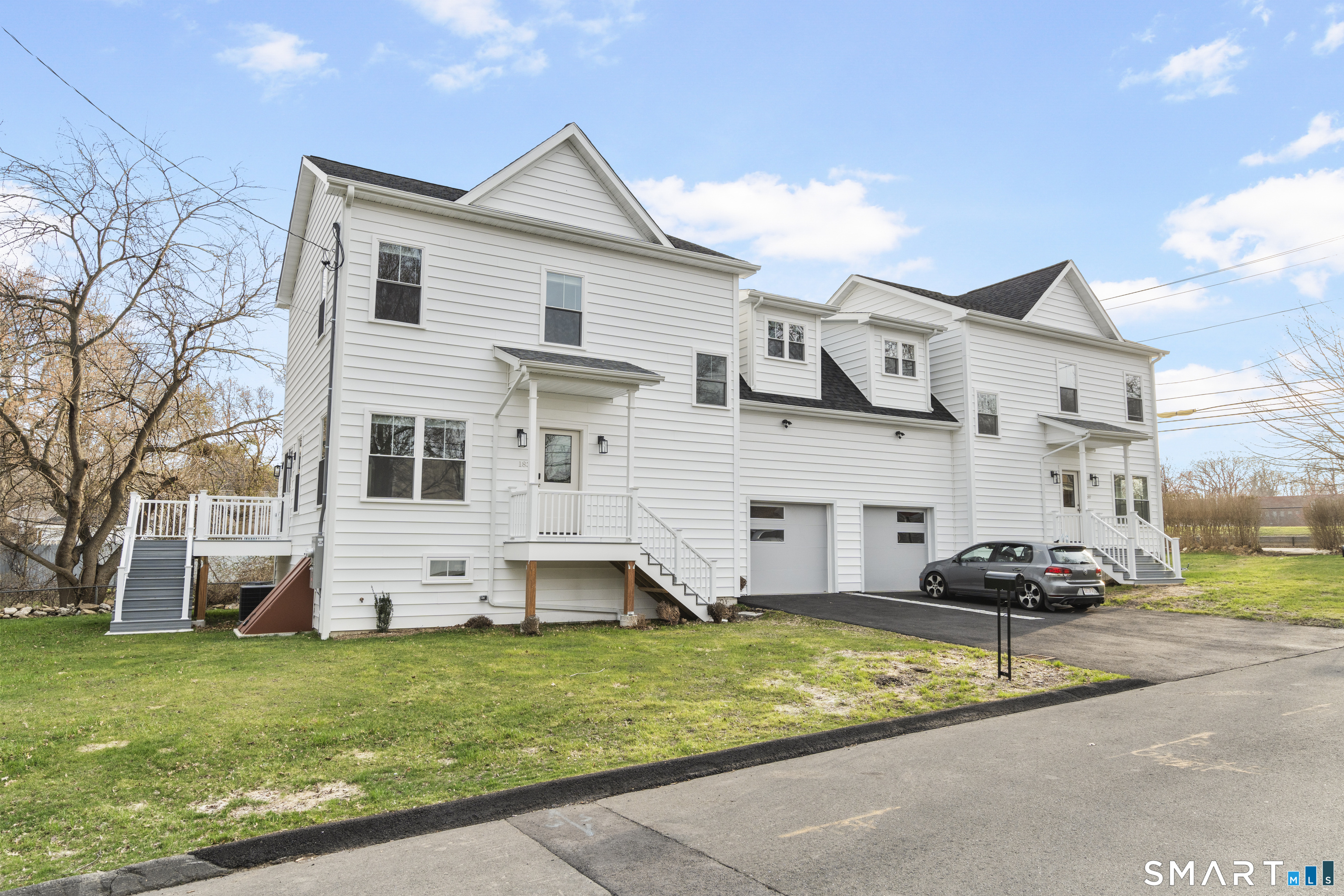 183 Vesper Street Fairfield, CT 06825 - Photo 40 of 40 a front view of a house with a garden and plants