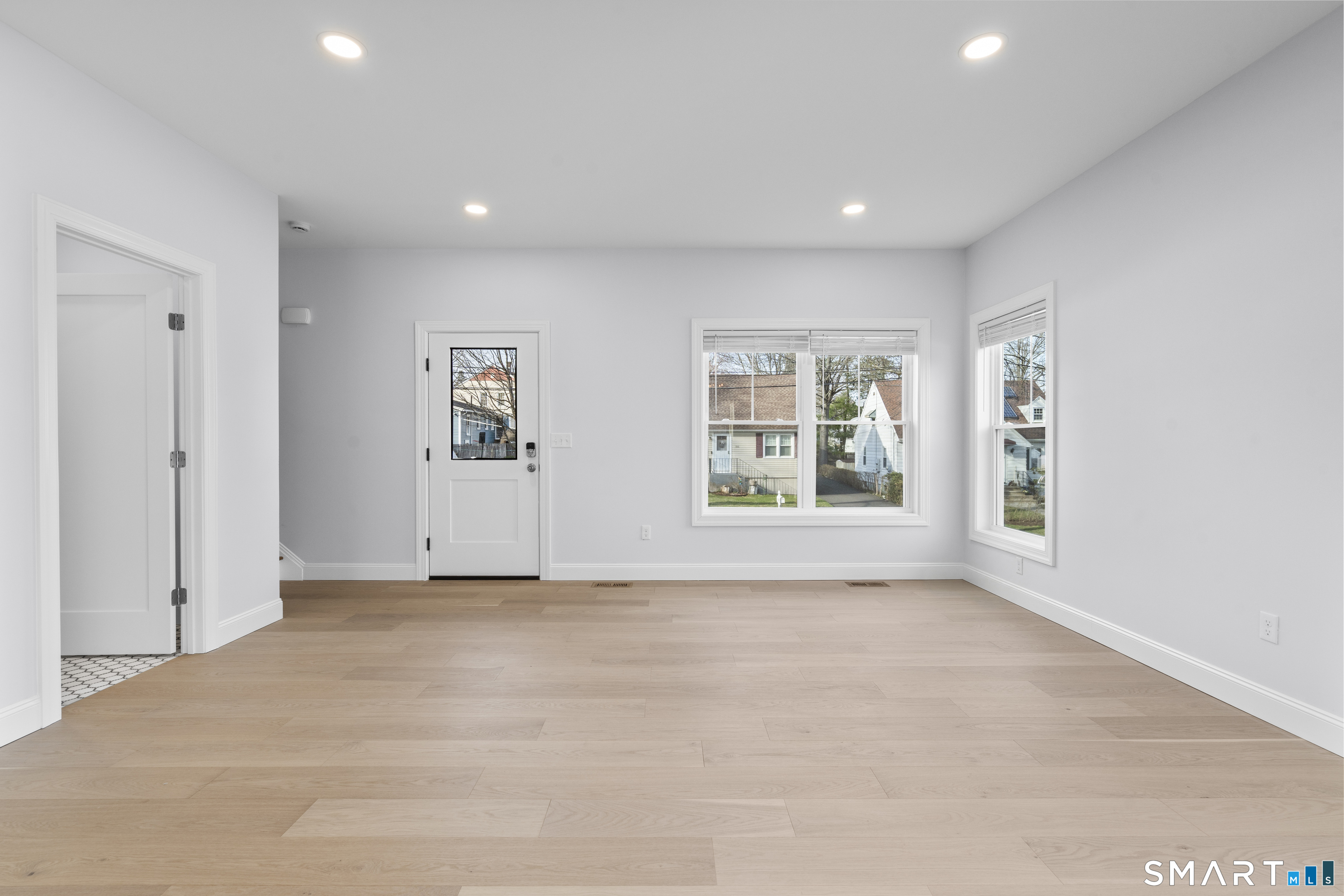 183 Vesper Street Fairfield, CT 06825 - Photo 6 of 40 a view of an empty room with a window