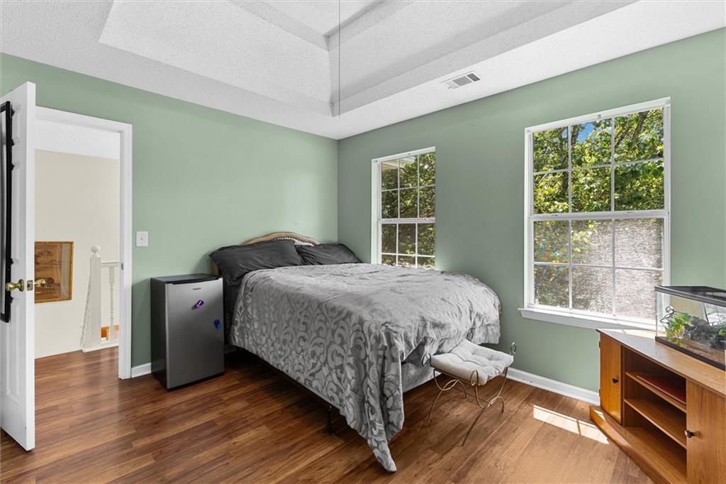 3234 Mineral Ridge Lane Stone Mountain, GA 30087 - Photo 31 of 55 a bed sitting in a bedroom next to a window