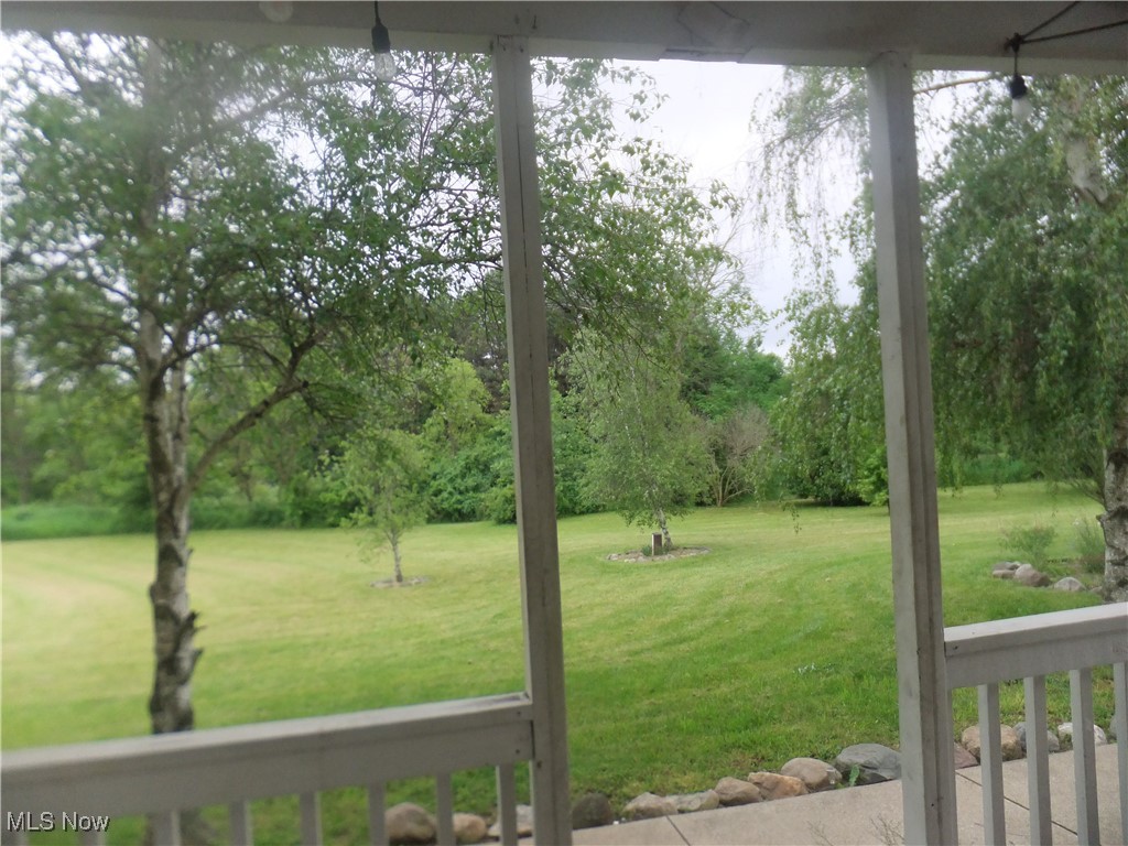 10677 Moss Road Lodi, OH 44254 - Photo 15 of 34 View of grassy yard with view of wooded area
